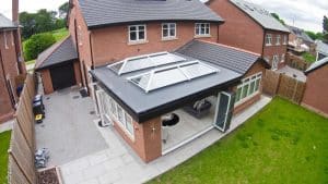 flat roof conservatory by garden