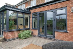 grey blue uPVC french door at the back of a house